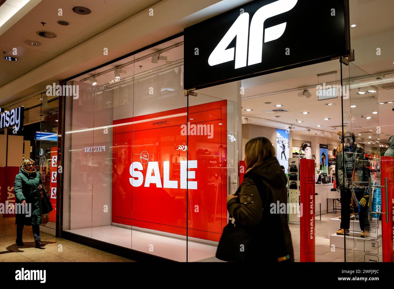 Krakow, Poland, 31st of January, 2024. A shopper walks in front of 4F shop in Krakow Gallery shopping mall as winter season sales continue in most high street shops. Credit: Dominika Zarzycka/Alamy Live News Stock Photo