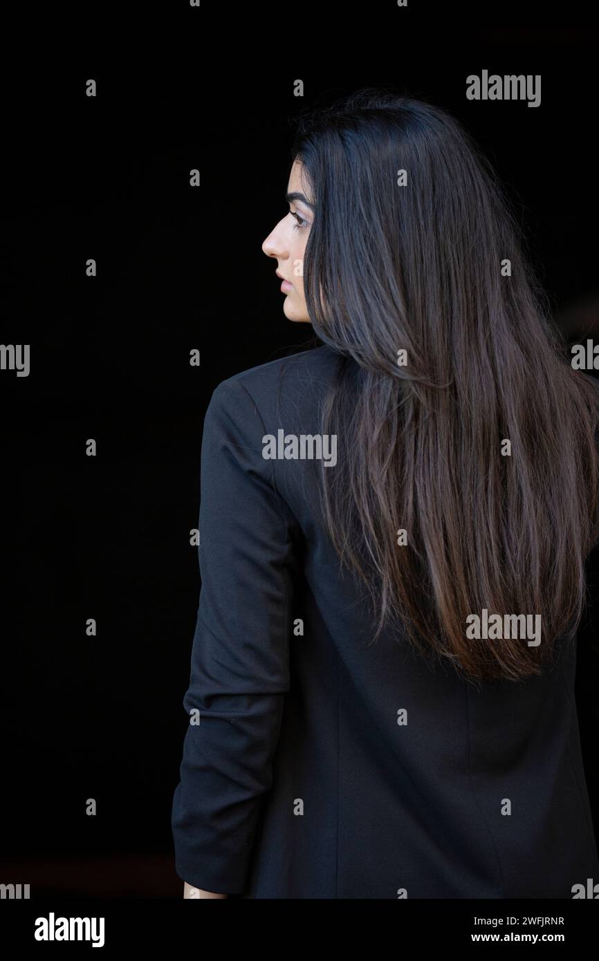 Rear view woman looking away Stock Photo - Alamy