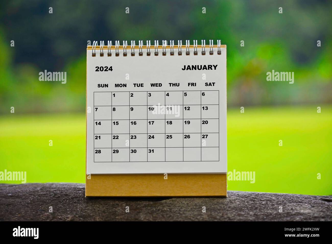 January 2024 white calendar with green blurred background Stock Photo ...
