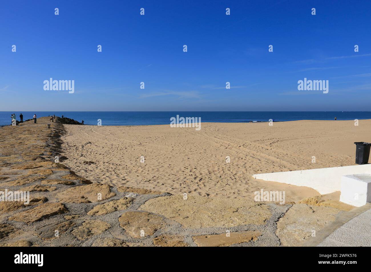 Playa de la Costilla beach and promenade in Rota city, Cadiz, on a sunny day Stock Photo