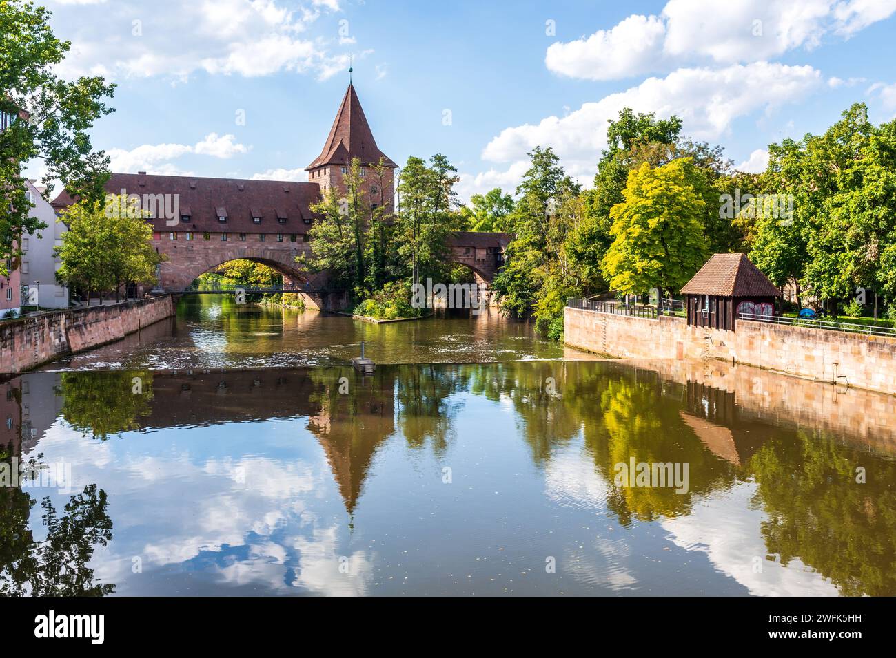 The Fronveste building and the Schlayerturm (tower) are part of the fortifications of the old town of Nuremberg, Germany, on the Pegnitz river. Stock Photo
