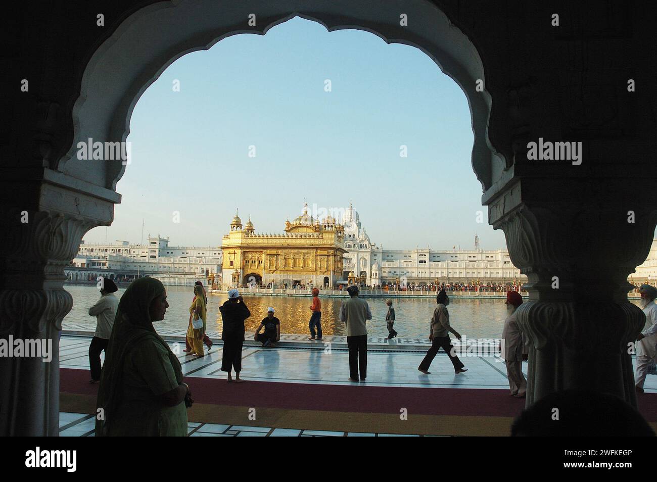 The Harmandir Sahib (or Hari Mandir) in Amritsar, Punjab, is the holiest shrine in Sikhism. Known as the Golden Temple, it was officially renamed Harmandir Sahib in March 2005. The temple (or gurdwara) is a major pilgrimage destination for Sikhs from all over the world, as well as an increasingly popular tourist attraction. The glorious temple is a living example of the spirit of tolerance and acceptance that the Sikh philosophy propounds. Amritsar, Punjab, India. Stock Photo