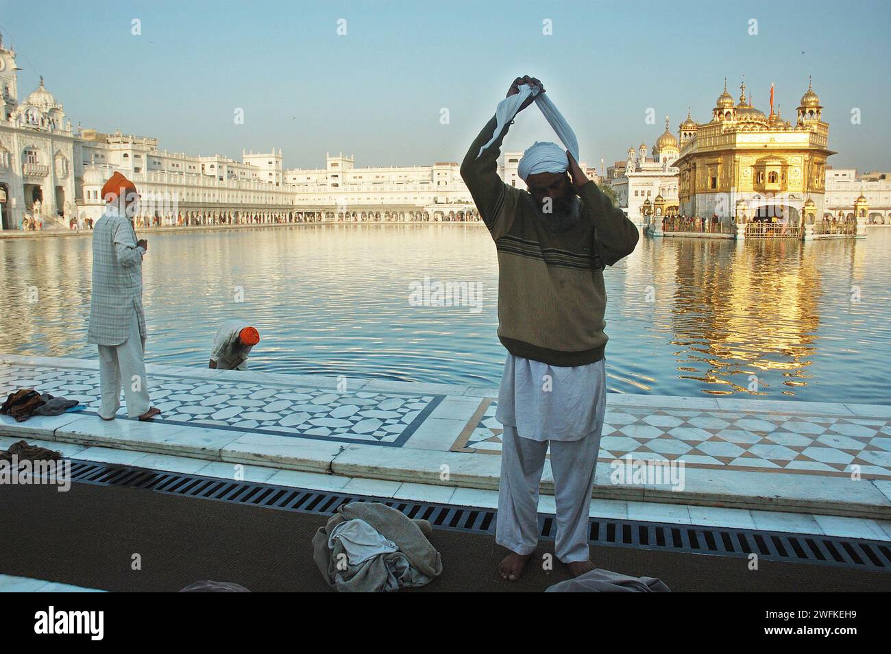 The Harmandir Sahib (or Hari Mandir) in Amritsar, Punjab, is the holiest shrine in Sikhism. Known as the Golden Temple, it was officially renamed Harmandir Sahib in March 2005. The temple (or gurdwara) is a major pilgrimage destination for Sikhs from all over the world, as well as an increasingly popular tourist attraction. The glorious temple is a living example of the spirit of tolerance and acceptance that the Sikh philosophy propounds. Amritsar, Punjab, India. Stock Photo
