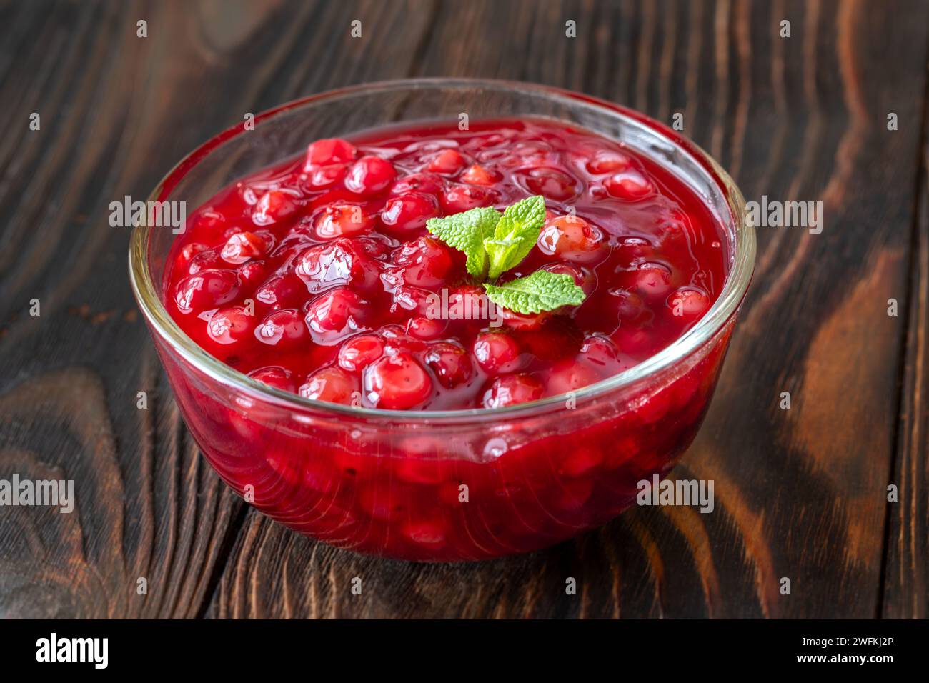 Glass bowl of traditional swedish lingonberry sauce Stock Photo