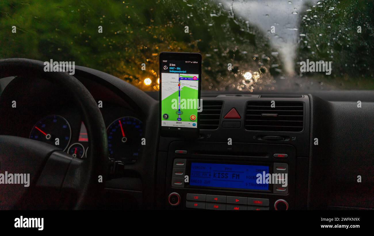 Waze maps showing the way thru the city. Driver using Waze maps Stock ...