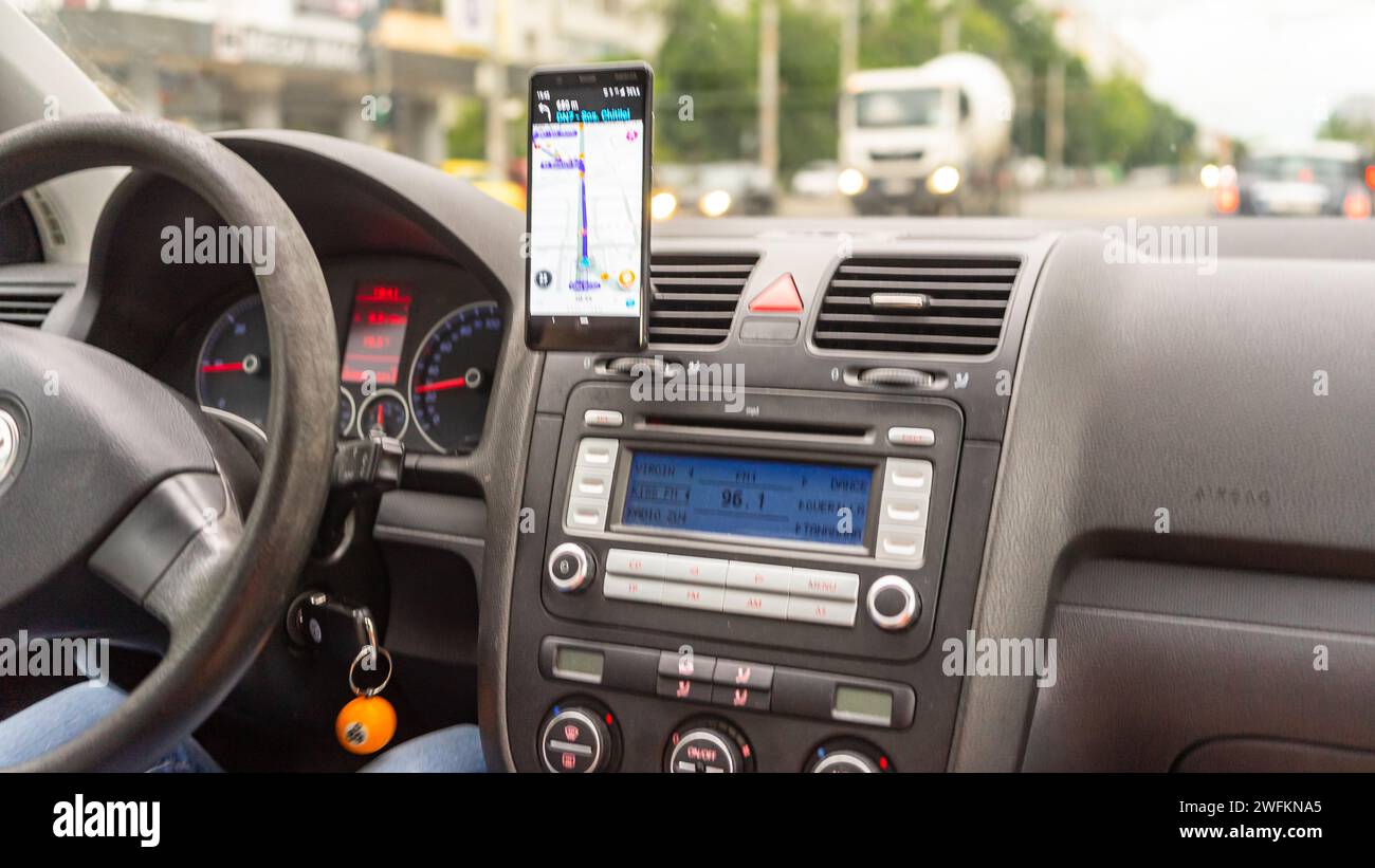Driver Using. Map Waze maps showing the way thru the city. Driver using Waze maps Stock ...