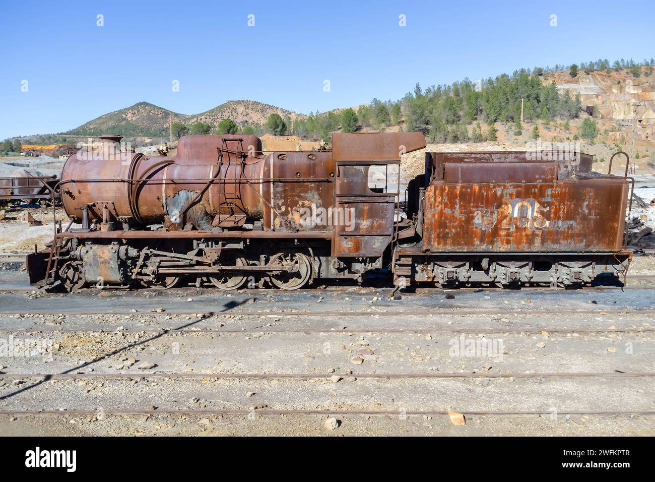 Old and rusty steam mining train used for transportation of the copper of  Corta Atalaya mining exploitation with the port of Huelva. Remains of the o Stock Photo