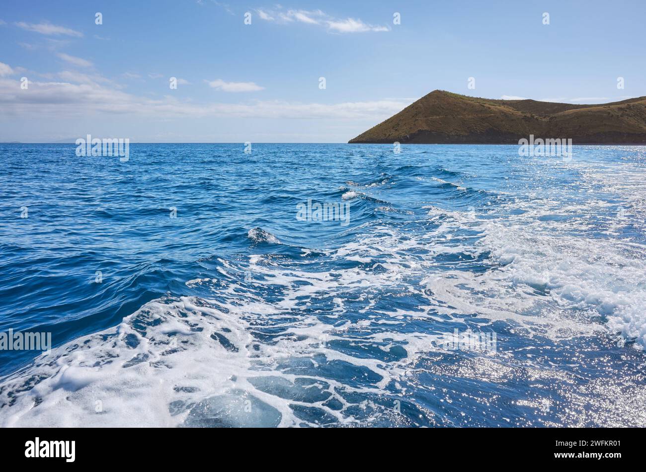 Pacific Ocean with an uninhabited island in the distance, Galapagos National Park, Ecuador. Stock Photo