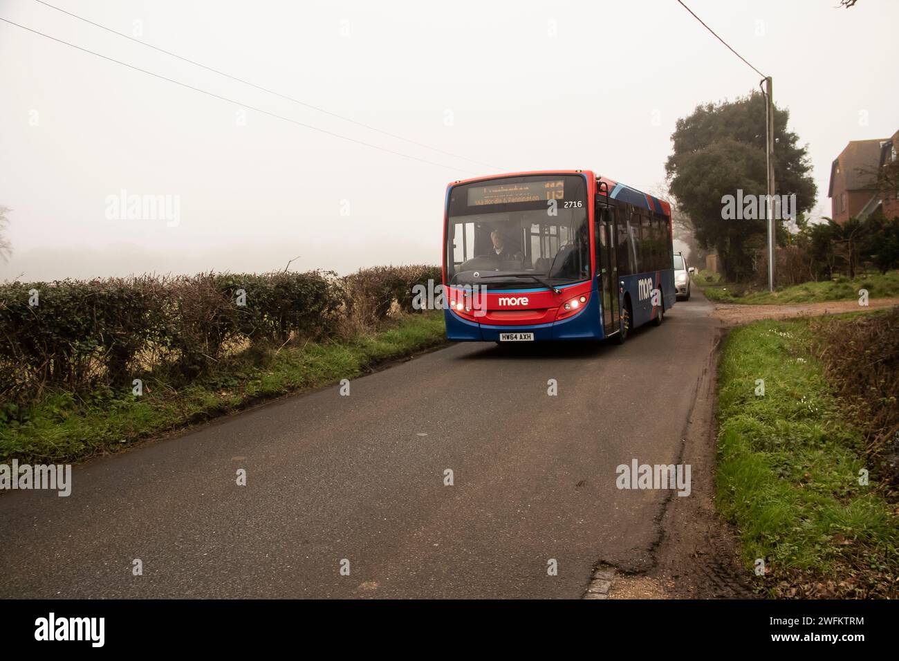 Morebus services New Forest Hampshire England. The first two are of service 119 diverted, and the other 3 of service 120, also in a quiet rural lane Stock Photo