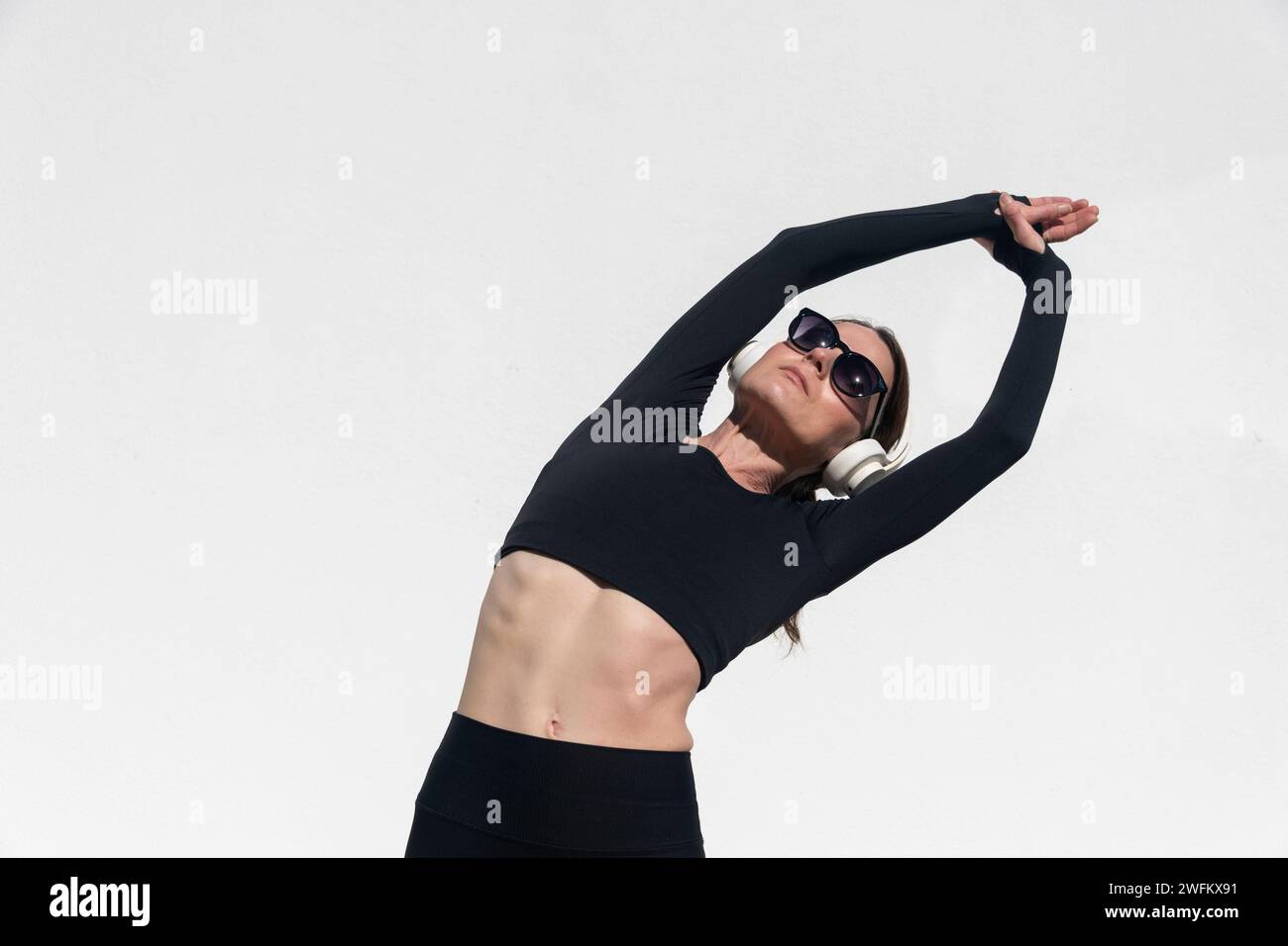 sporty woman wearing headphones during exercises Stock Photo Alamy