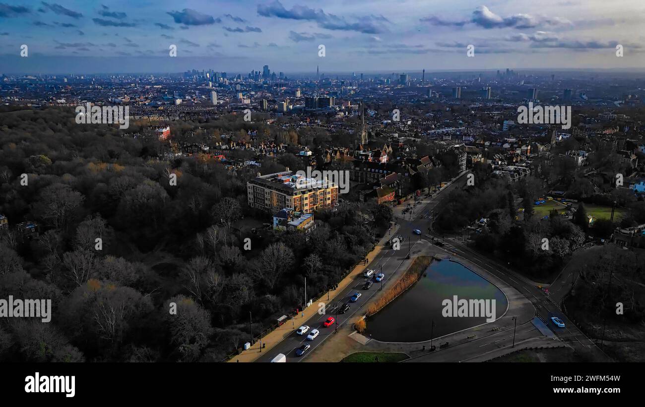 Aerial view of a city skyline at dusk with urban park, water bodies ...