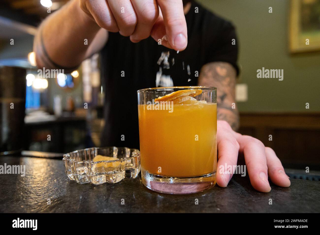 Bartender makes Oaxacacillin cocktail at The Red Door on Peck Street in Providence, Rhode Island on June 3, 2022 Stock Photo