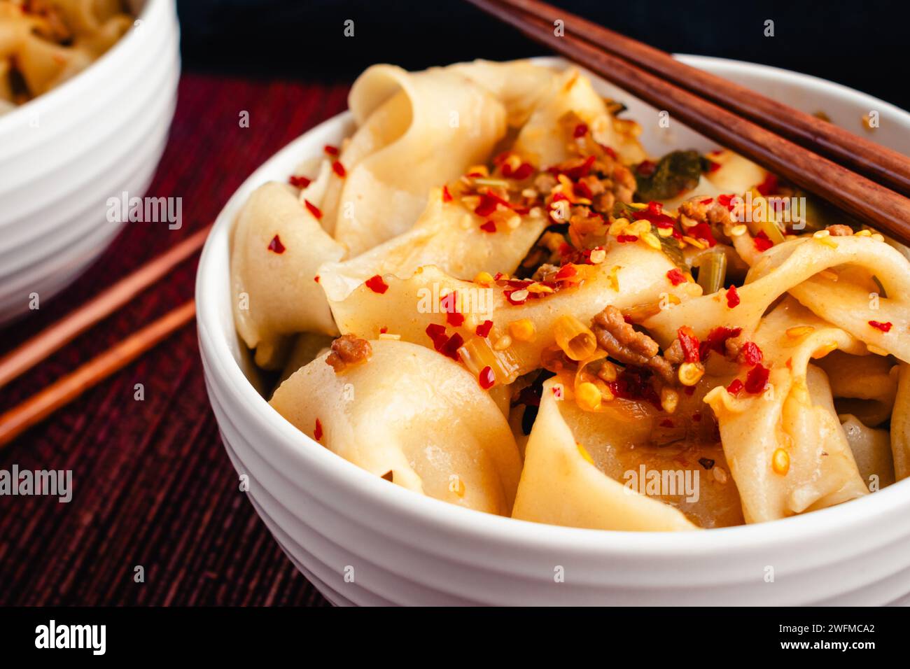 Biang Biang Noodles Topped With Spicy Chili Oil Sauce Close Up Biang Biang Biang Noodles Topped With Spicy Chili Oil Sauce Close Up Biang