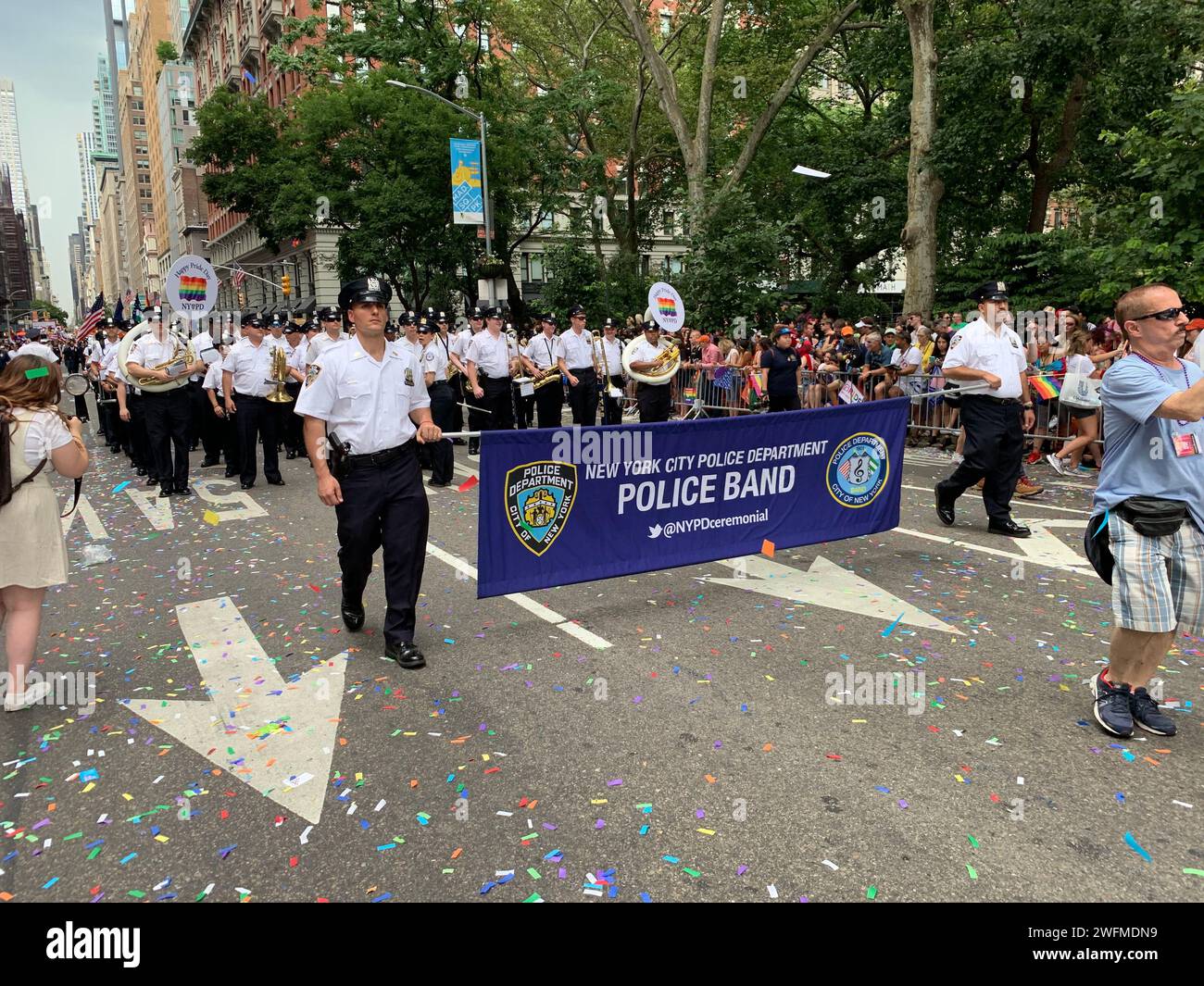 The NYPD shows their support for the LBGT community with their marching band participating in the Gay Pride Parade Stock Photo