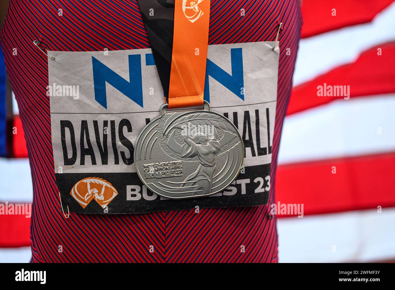 Tara Davis celebrating his medal with the flag in the Budapest 2023
