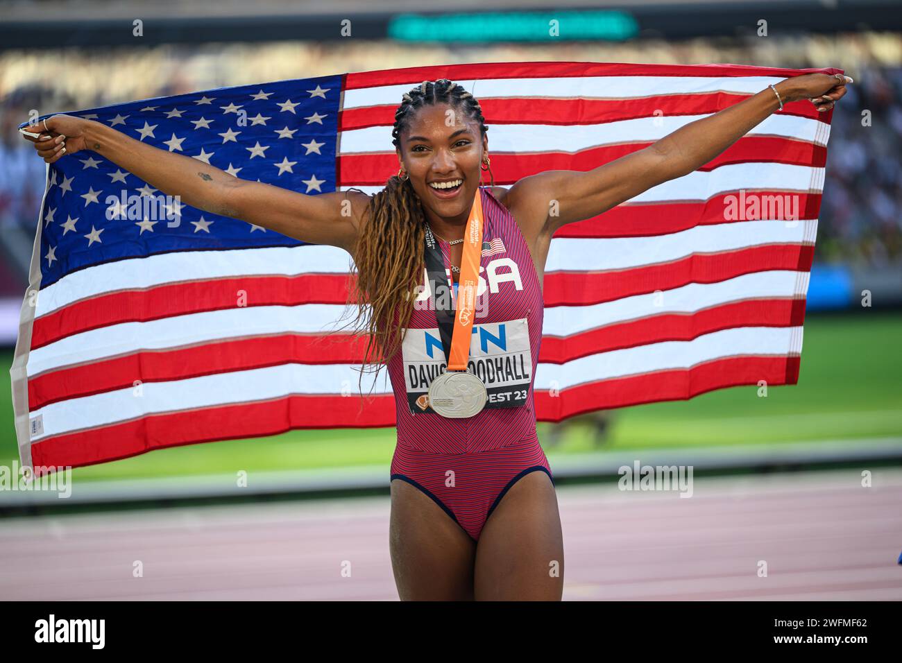 Tara Davis celebrating his medal with the flag in the Budapest 2023 ...