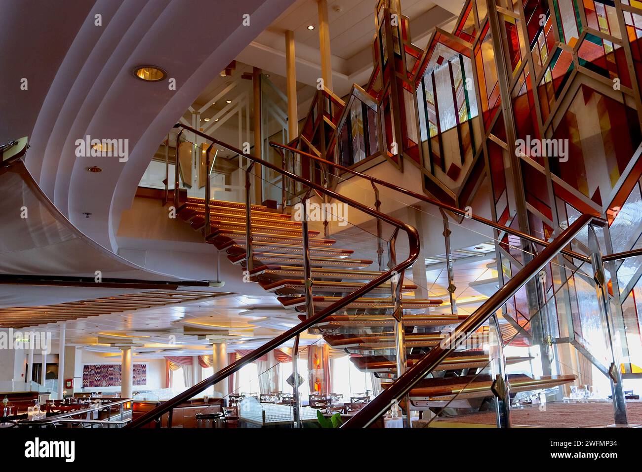 Spectacular staircase leading to the Medina restaurant, its interior design inspired by Moorish styles and colours aboard P&O’s cruise ship Aurora. Stock Photo
