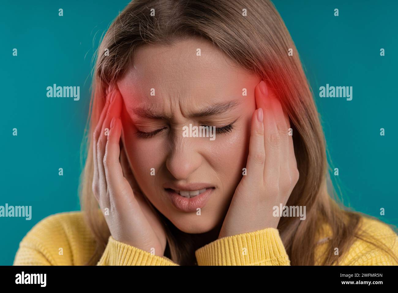 Portrait of beautiful suffering woman having headache, studio portrait. Migraine Stock Photo