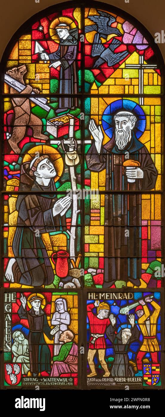 BERN, SWITZERLAND - JUNY 27, 2022: The and St. Gallus and St. Mainrad on the stained glass in the church Dreifaltigkeitskirche by A. Schweri (1938). Stock Photo