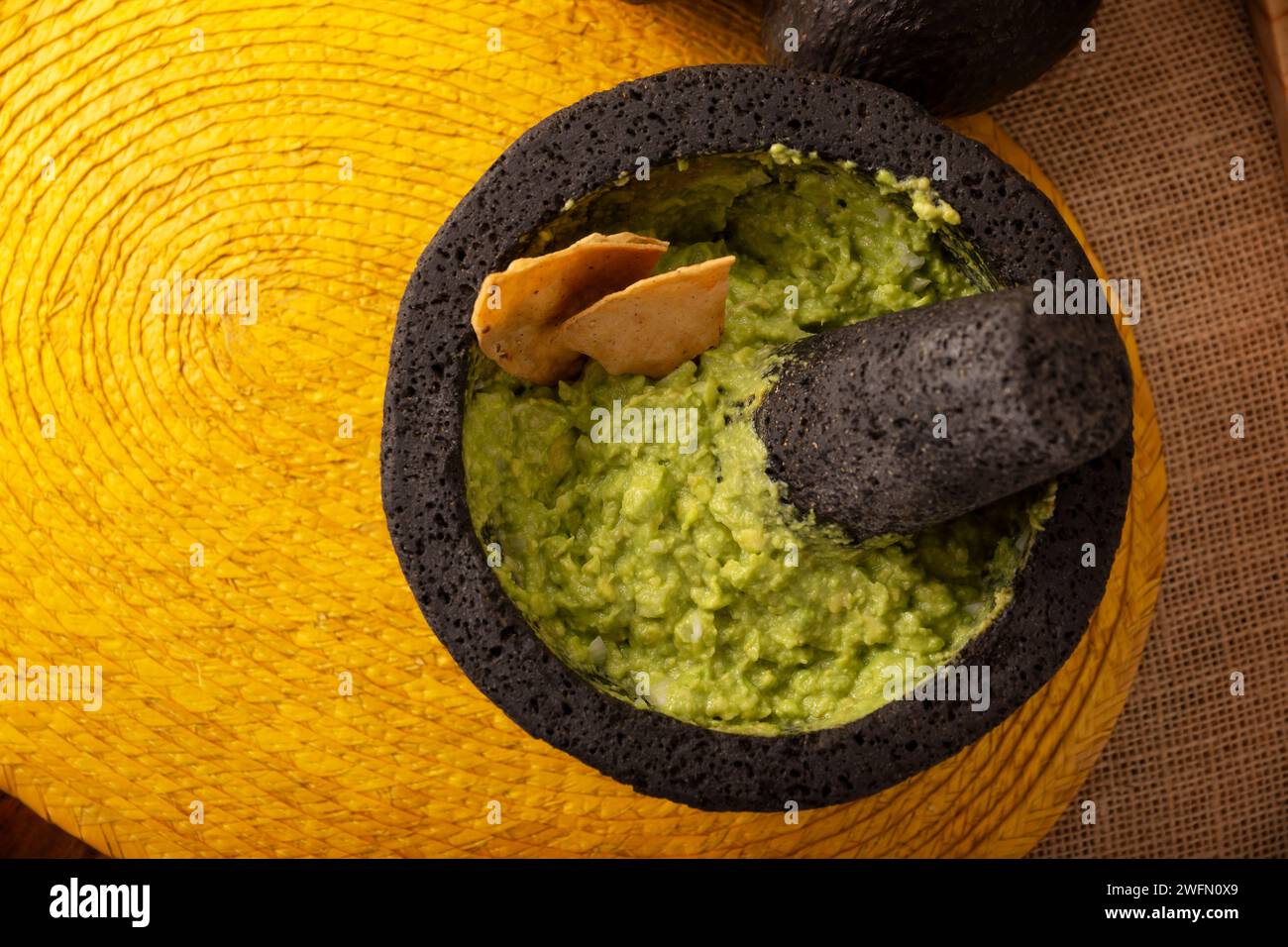 Guacamole. Avocado dip with tortilla chips also called Nachos served in ...