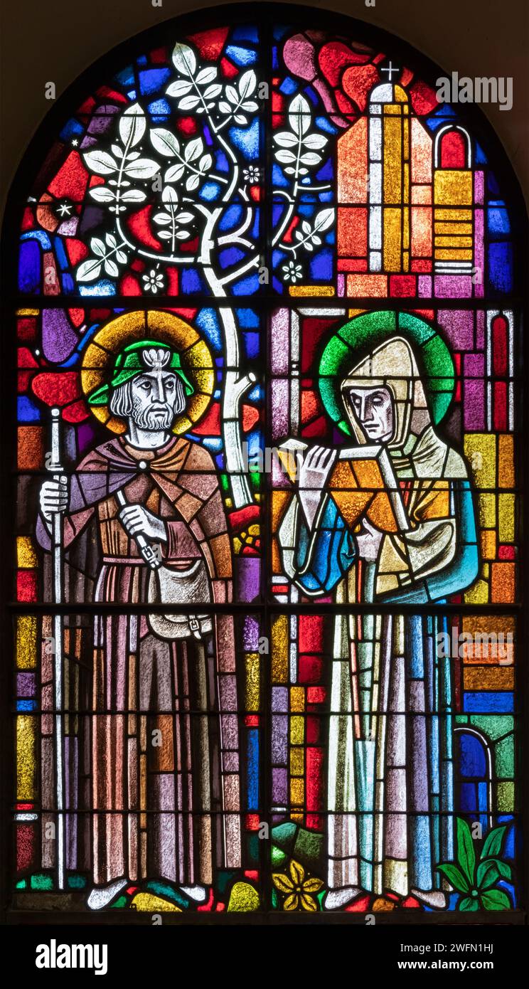 BERN, SWITZERLAND - JUNY 27, 2022: The St. Fridolin and St. Ulrich on the stained glass in the church Dreifaltigkeitskirche by A. Schweri (1938). Stock Photo