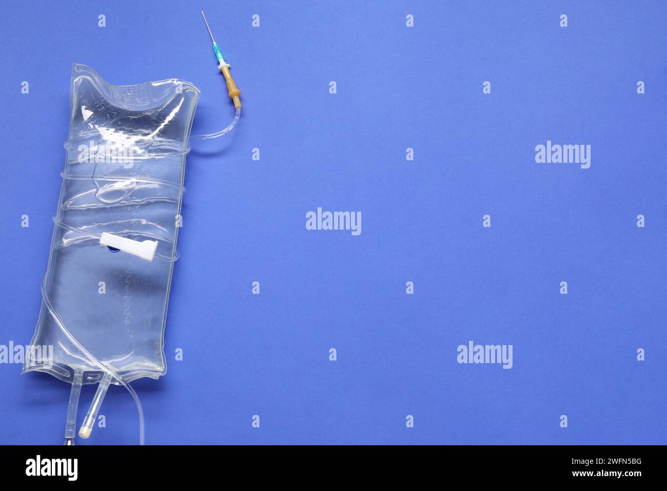Infusion Set Background IV infusion set on blue background, top view. Space for text Stock ...