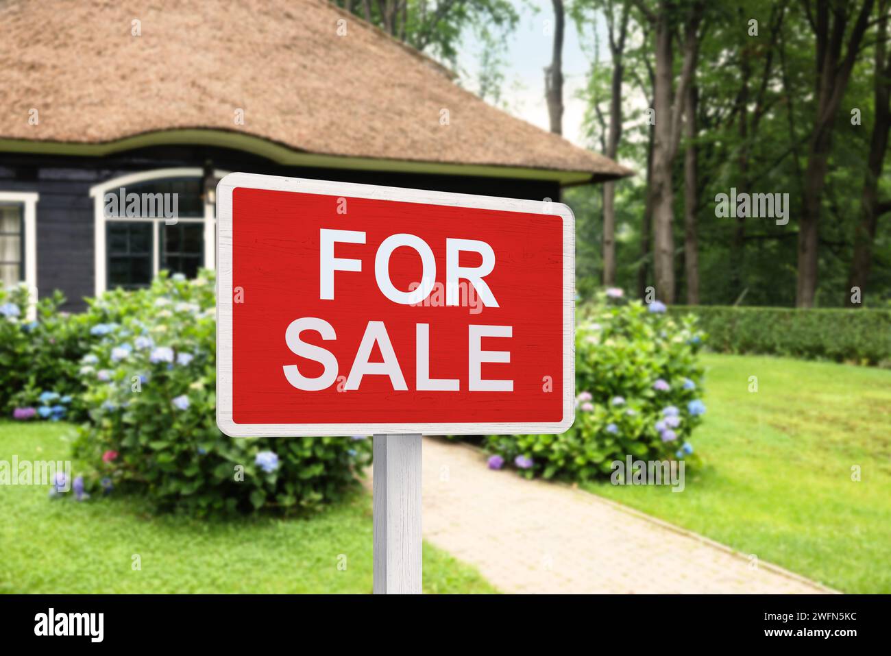 Sale sign near beautiful house outdoors. Red signboard with words Stock ...