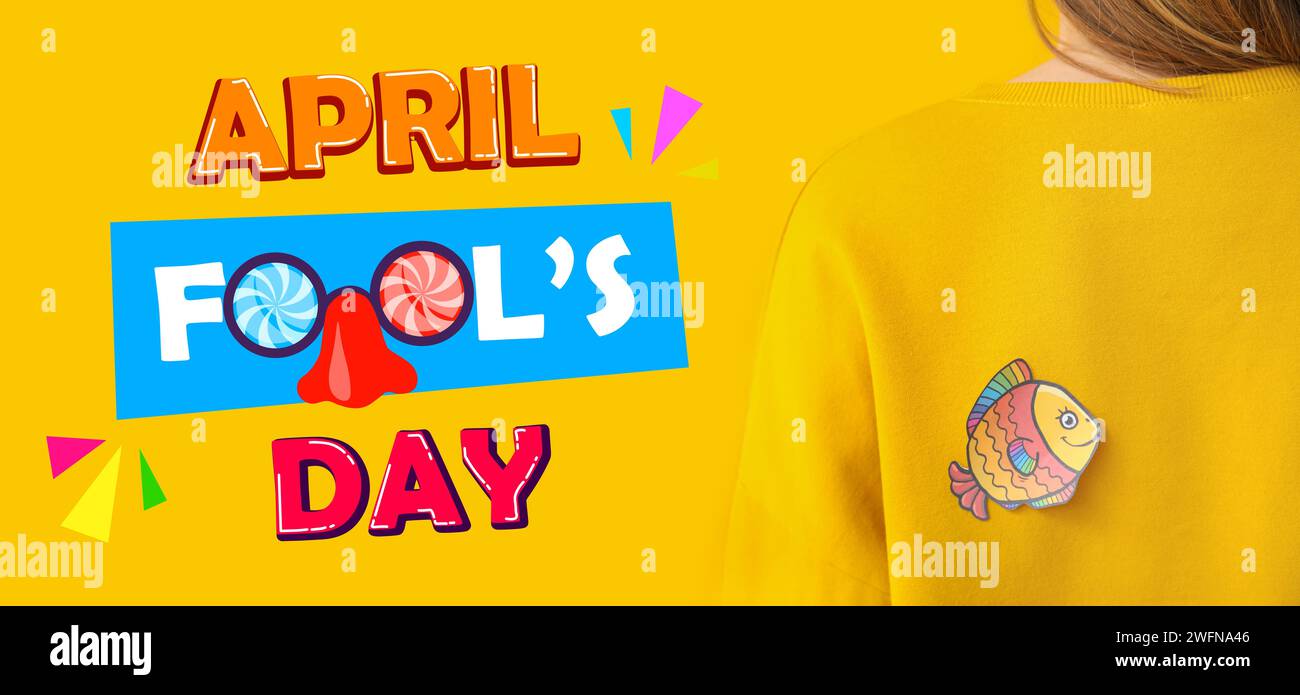 Banner for April Fools' Day with paper fish on woman's back Stock Photo ...