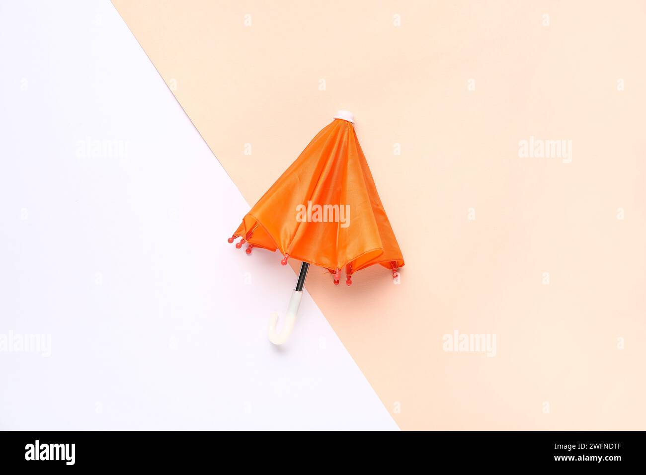 Mini stylish umbrella on colorful background Stock Photo