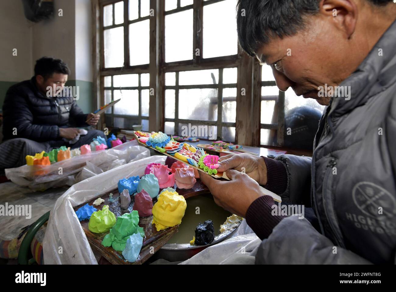 **CHINESE MAINLAND, HONG KONG, MACAU AND TAIWAN OUT** Craftsmen make butter sculptures to greet the upcoming Losar, or Tibetan New Year in Lhasa City, Stock Photo