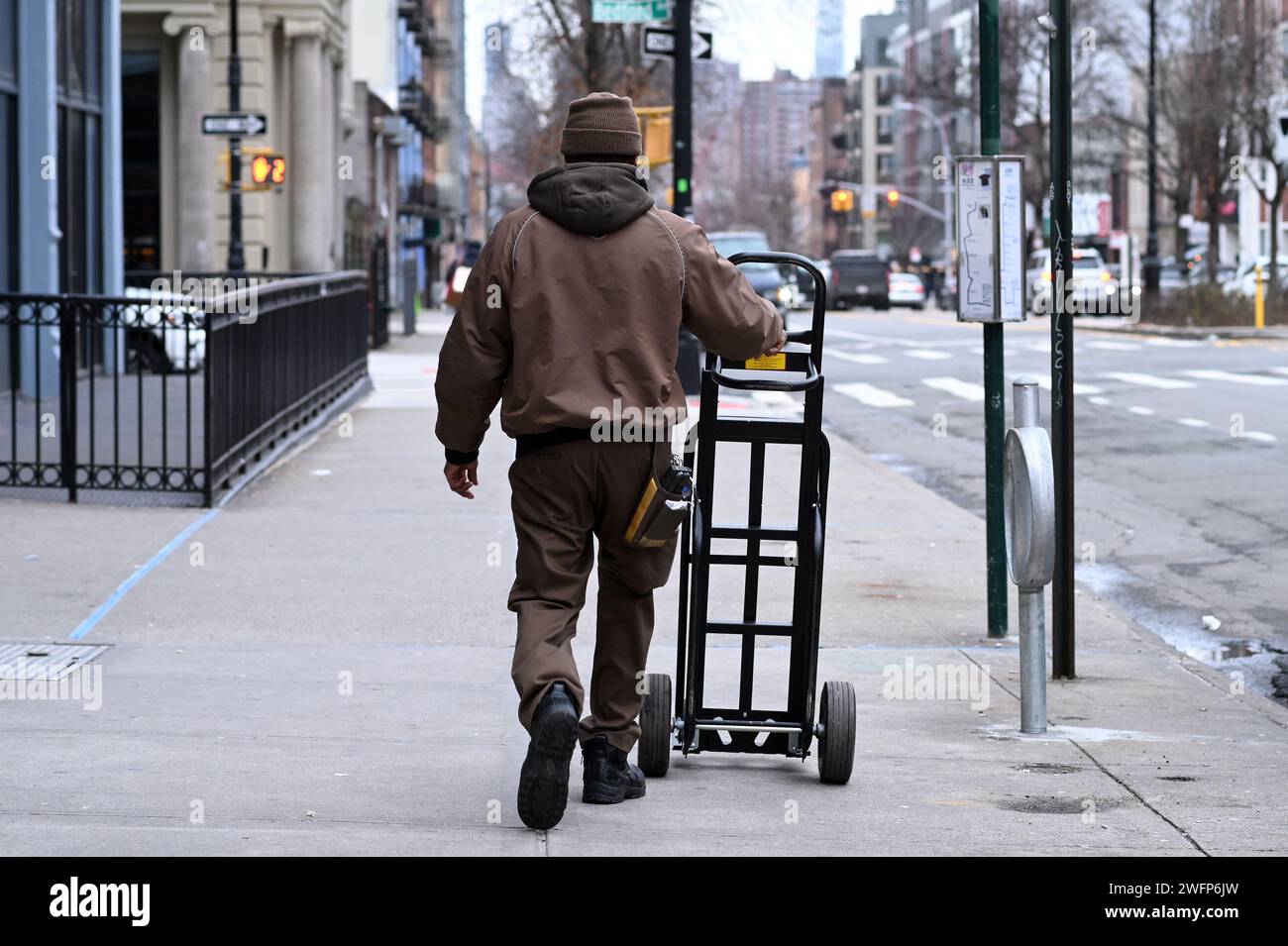 Ny Package Program New York, USA. 31st Jan, 2024. A UPS driver pushes an empty handcart ...