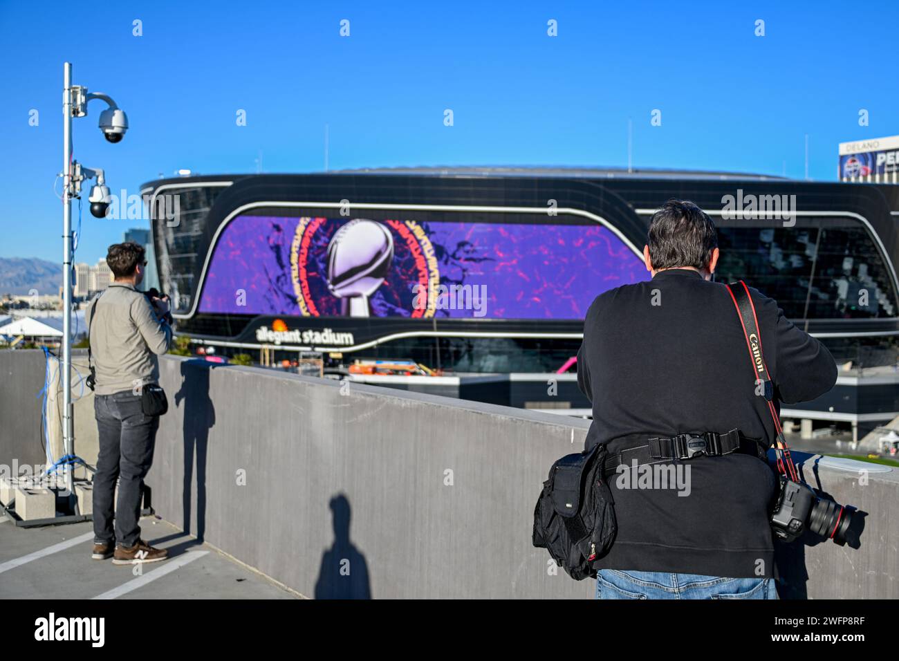 Associated Press photographer John Locher (left) and Getty Images ...