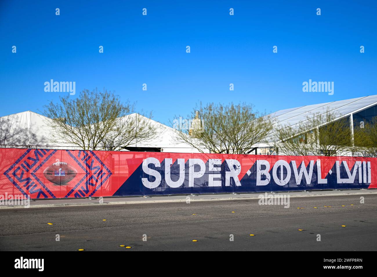 A fence around Allegiant Stadium with Super Bowl LVIII signage, Tuesday