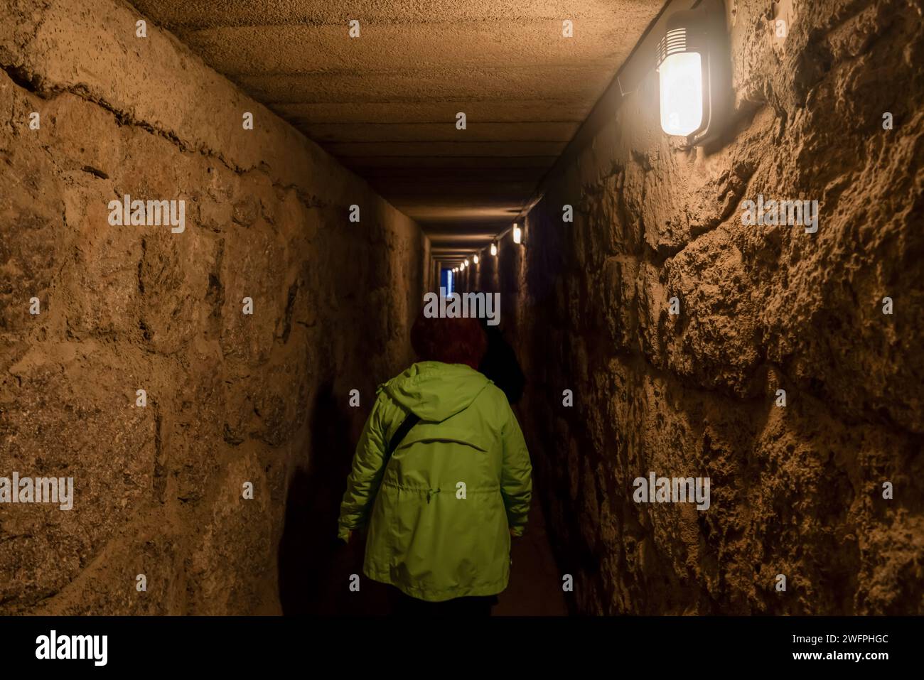 A tourist uses an underground tunnel to visit the tomb inside the ...