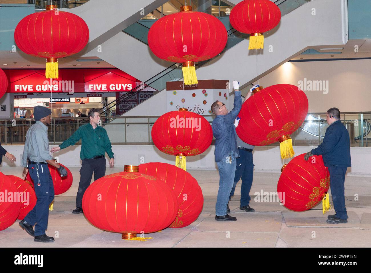 Texas, USA. 31st Jan, 2024. Staff members install red lanterns inside
