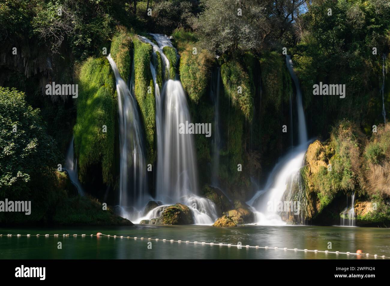 Kravice waterfalls on river Trebizat in summer during sunny day, long exposure with silky water Stock Photo