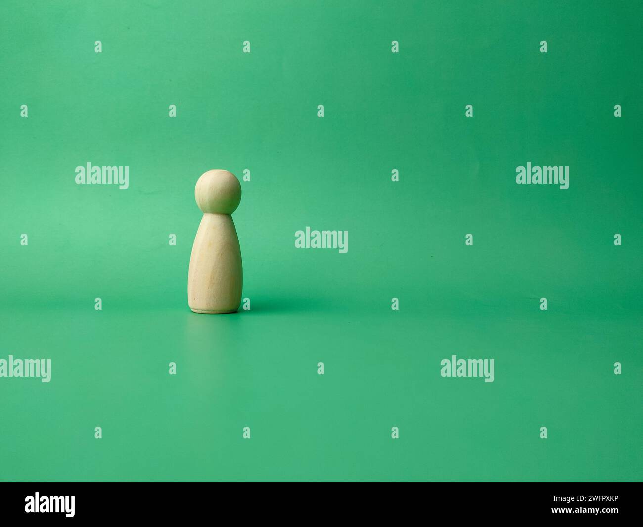 Wooden figure doll 1 piece with copy space. The idea of working Stock Photo