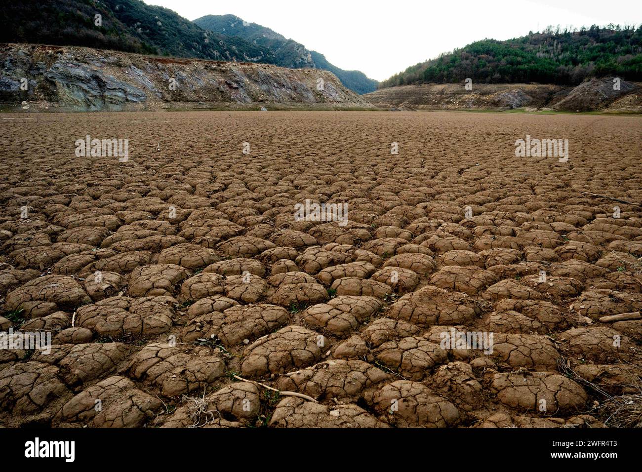 february, 01 2024 Cercs, Spain Drought Barcelona-Baells Reservoir Drought, Llobregat river Photo Eric Renom/LaPresse The Baells reservoir, which is nourished by the Llobregat River, is under minimum levels the day Catalonia declares a state of emergency due to drought in the metropolitan area of Barcelona, limiting the use of water or showers in gyms. The Llobregat River, the river that feeds this reservoir, is the most industrialized river in Catalonia, as it supplies the entire industrial area around Barcelona and is therefore vital for the operation of the Catalan industry, from the car b Stock Photo