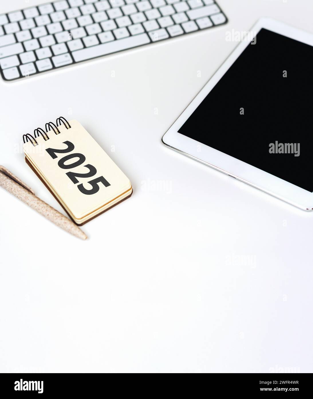 Business planning and forecasting in 2025. Notepad with 2025, Digital