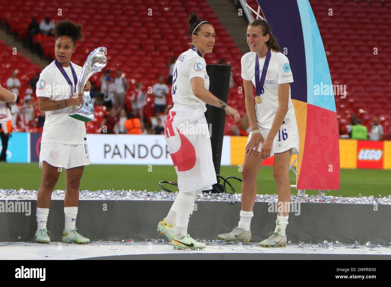 Demi Stokes, Lucy Bronze and Jill Scott with trophy winners medals UEFA Women's Euro Final 2022 England v Germany Wembley Stadium, London 31 July 2022 Stock Photo
