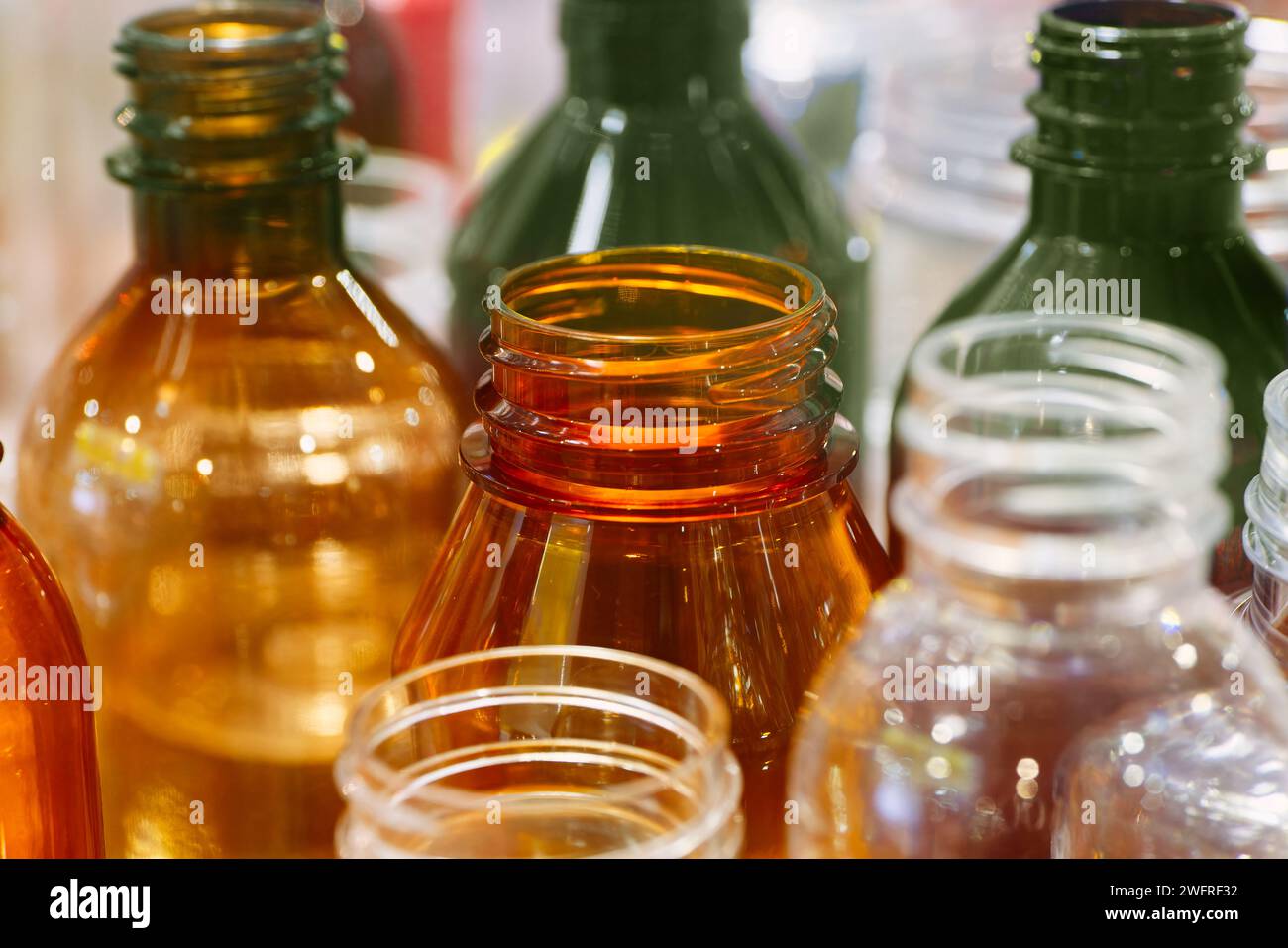 Group of empty multicolor transparent plastic bottles, abstract industrial or recycling background Stock Photo