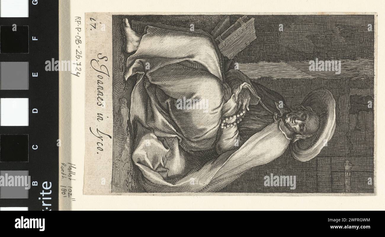 Saint John of Lycopolis as a recluse in his cell, Boëtius Adamsz. Bolswert, after Abraham Bloemaert, 1619 print Saint John of Lycopolis as a recluse in his cell prays the rosary. On the Verso is a fragment French text. print maker: Amsterdampublisher: Low Countriespublisher: Antwerp paper engraving saints. anchorite, hermit Stock Photo