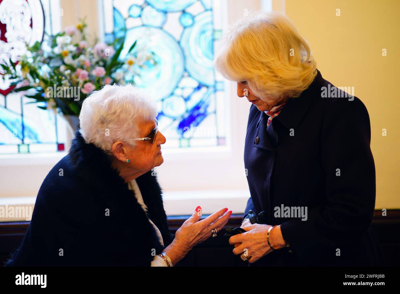 Queen Camilla meeting residents of St John's Foundation almshouses at the Chapel of St Michael Within as she carry out engagements celebrating the 850th anniversary of St John's Foundation in Bath. Picture date: Thursday February 1, 2024. Stock Photo