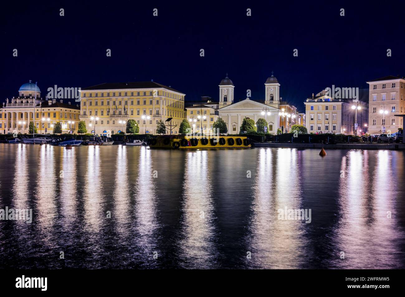 Trieste Night Dusk and night in Trieste. Between historic buildings and the sea Stock ...
