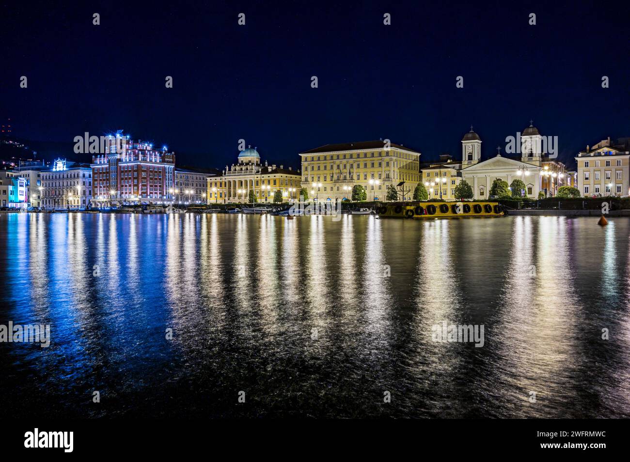 Trieste Night Dusk and night in Trieste. Between historic buildings and the sea Stock ...