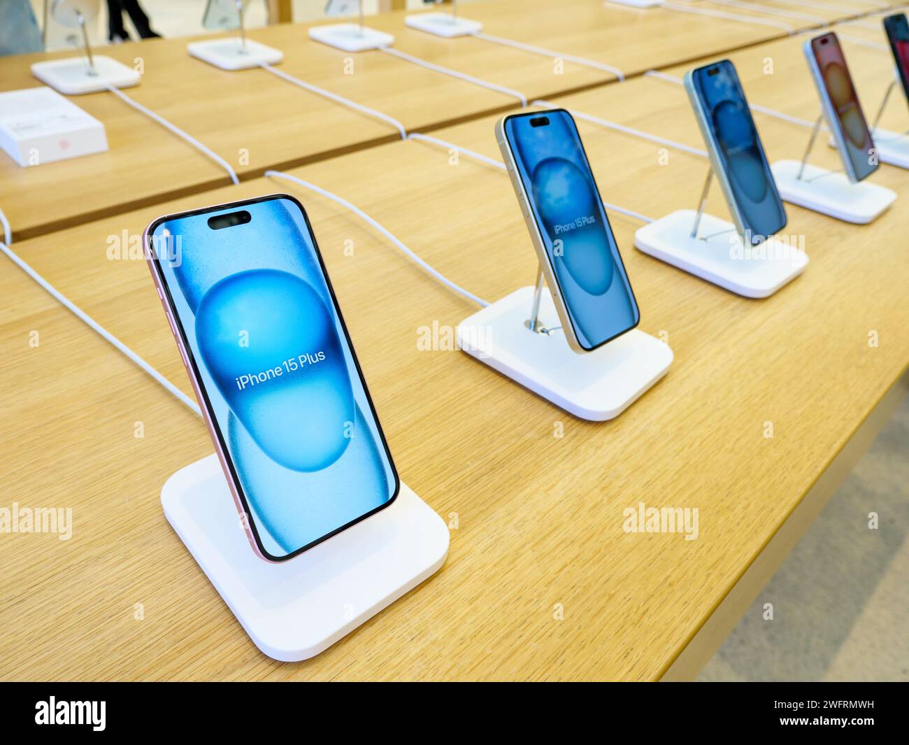 London, UK - January 9, 2024: Apple iPhone 15 Plus smartphones for sale inside the Apple Store Stock Photo