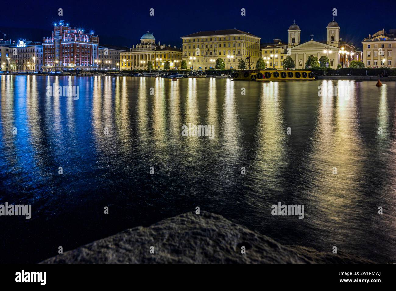 Trieste Night Dusk and night in Trieste. Between historic buildings and the sea Stock ...
