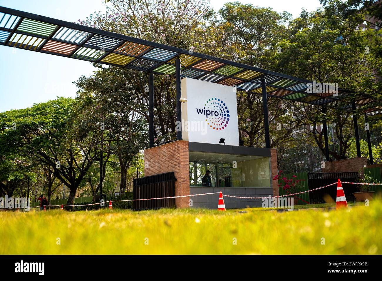 Wipro logo is shown at the entrance of their Sarjapur campus. Wipro ltd. is a leading technology services and consulting company. Stock Photo