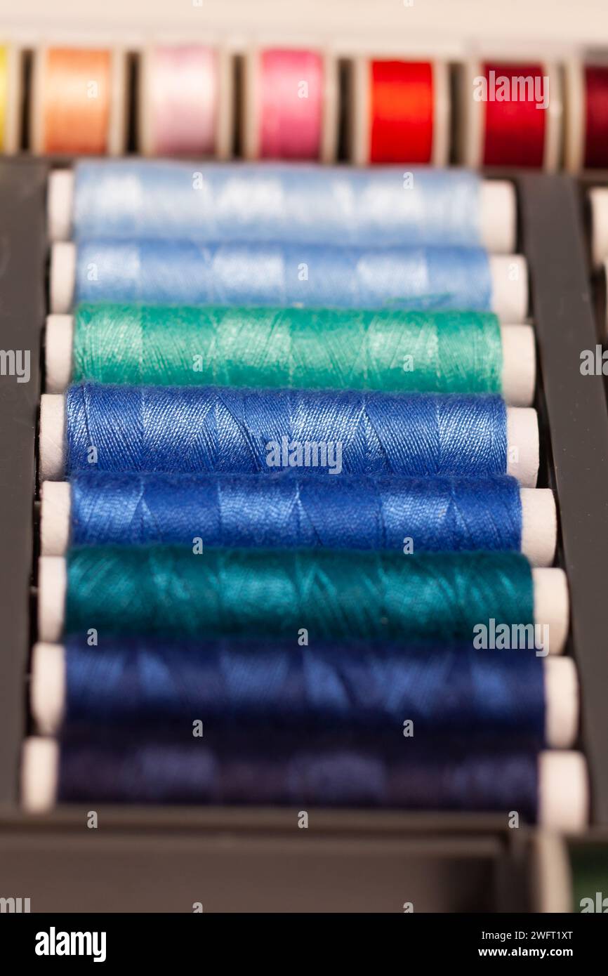 colorful sewing threads on spools Stock Photo