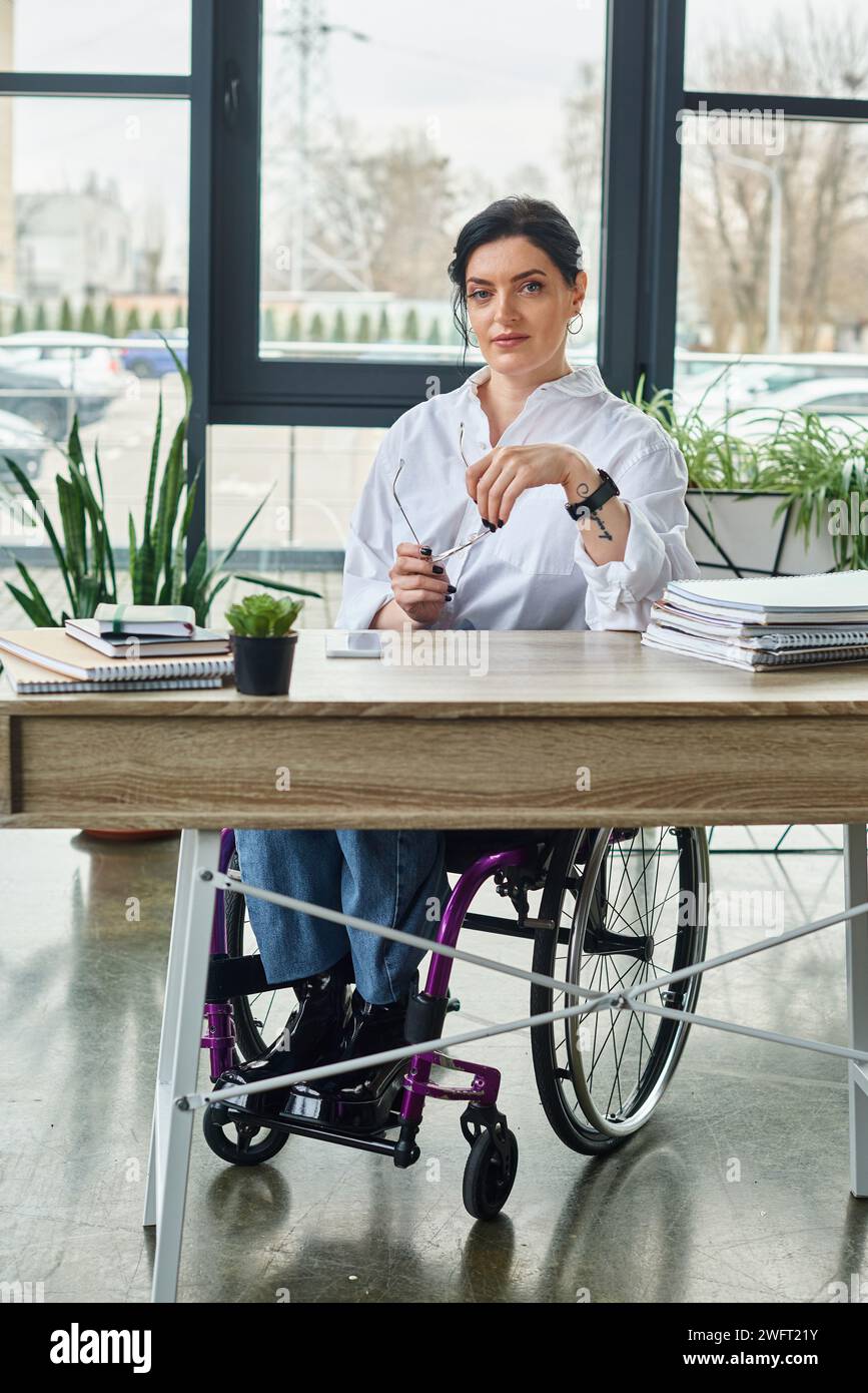 good looking confident businesswoman with disability in wheelchair with